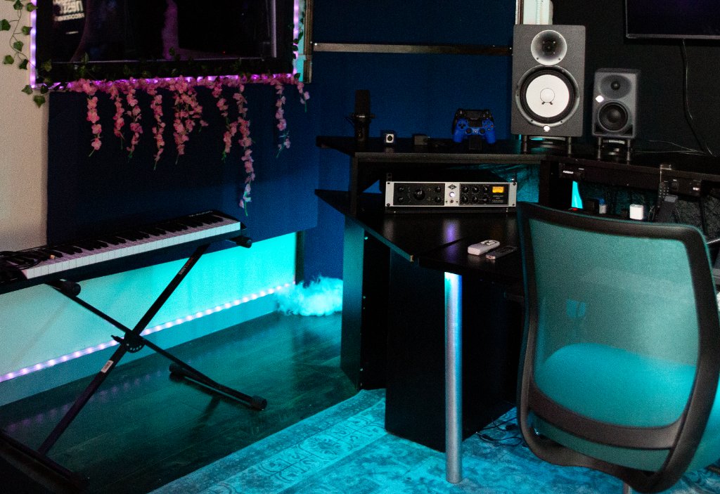 Close-up of the desk, speakers and gear
