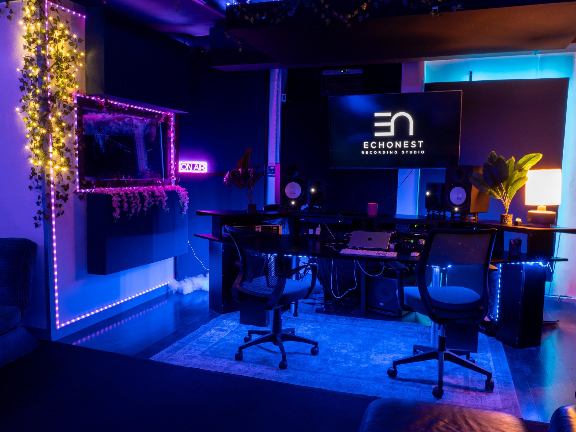 Wide view of the control room with seating for everyone at the session