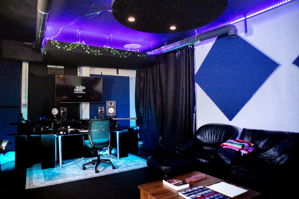 Wide view of the space under a purple LED ceiling
