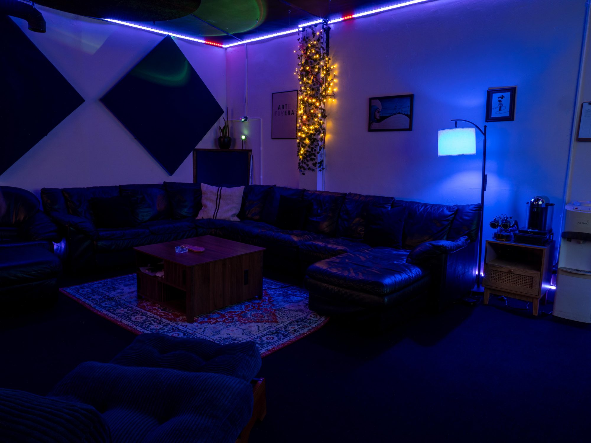 The lounge, with its sectional sofa and acoustic panelling